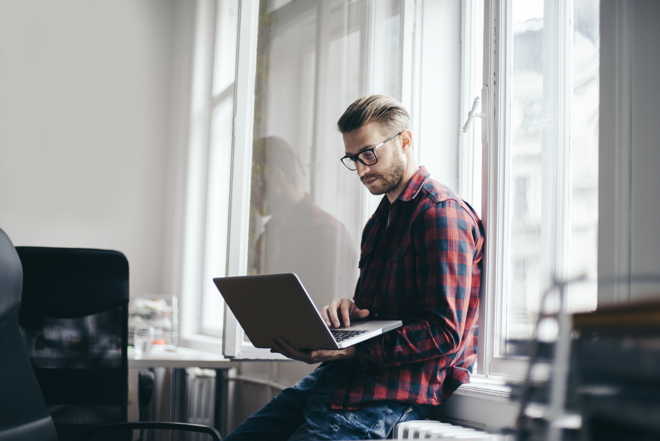 Young designer working from home office